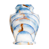 Carpel Blue Onyx cremation urn with polished radiant blue natural stone, layered cloud patterns, and warm brown marbling