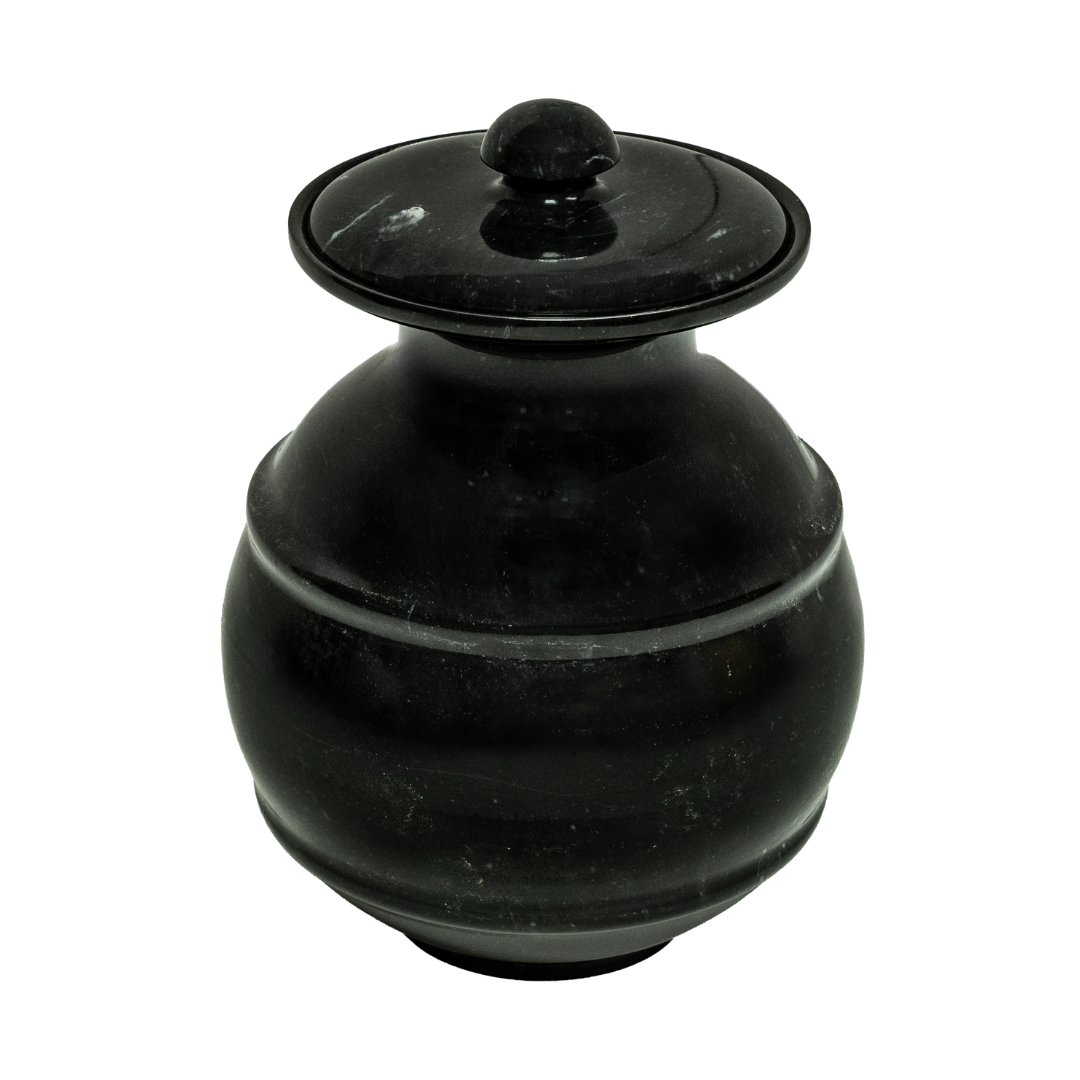 Ebony marble pet urn with polished black natural stone, bold white and gray veining, engraved design, and elegant memorial shape
